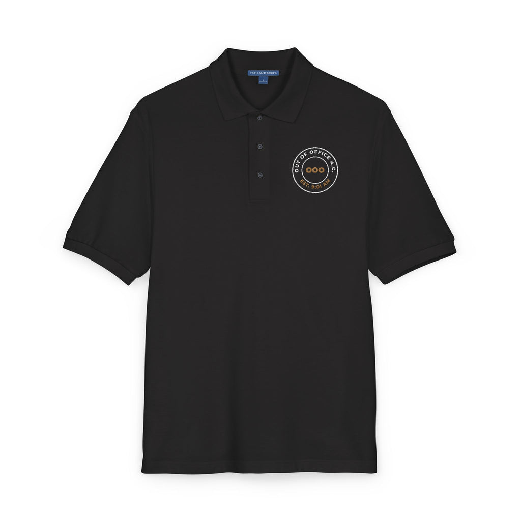 Close-up of the embroidered chest on the black Out of Office Athletic Club polo by Mildly Unavailable