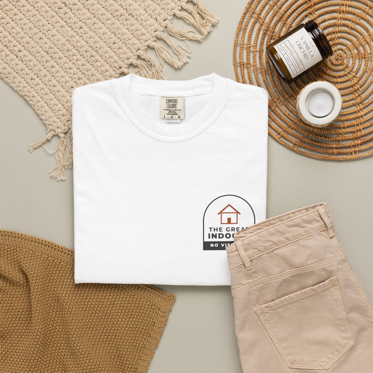 Flat-lay of the white The Great Indoors tee by Mildly Unavailable