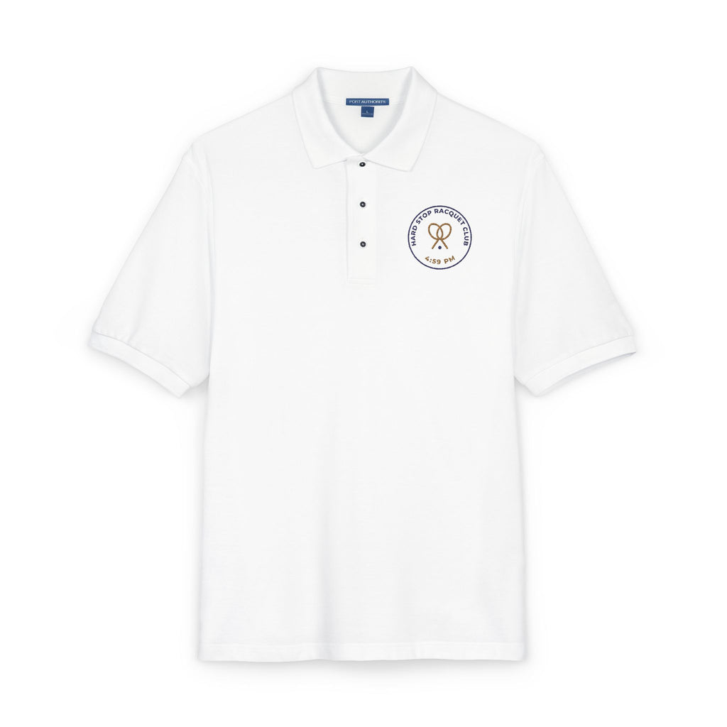 Close-up of the embroidered chest on the white Hard Stop Racquet Club polo by Mildly Unavailable