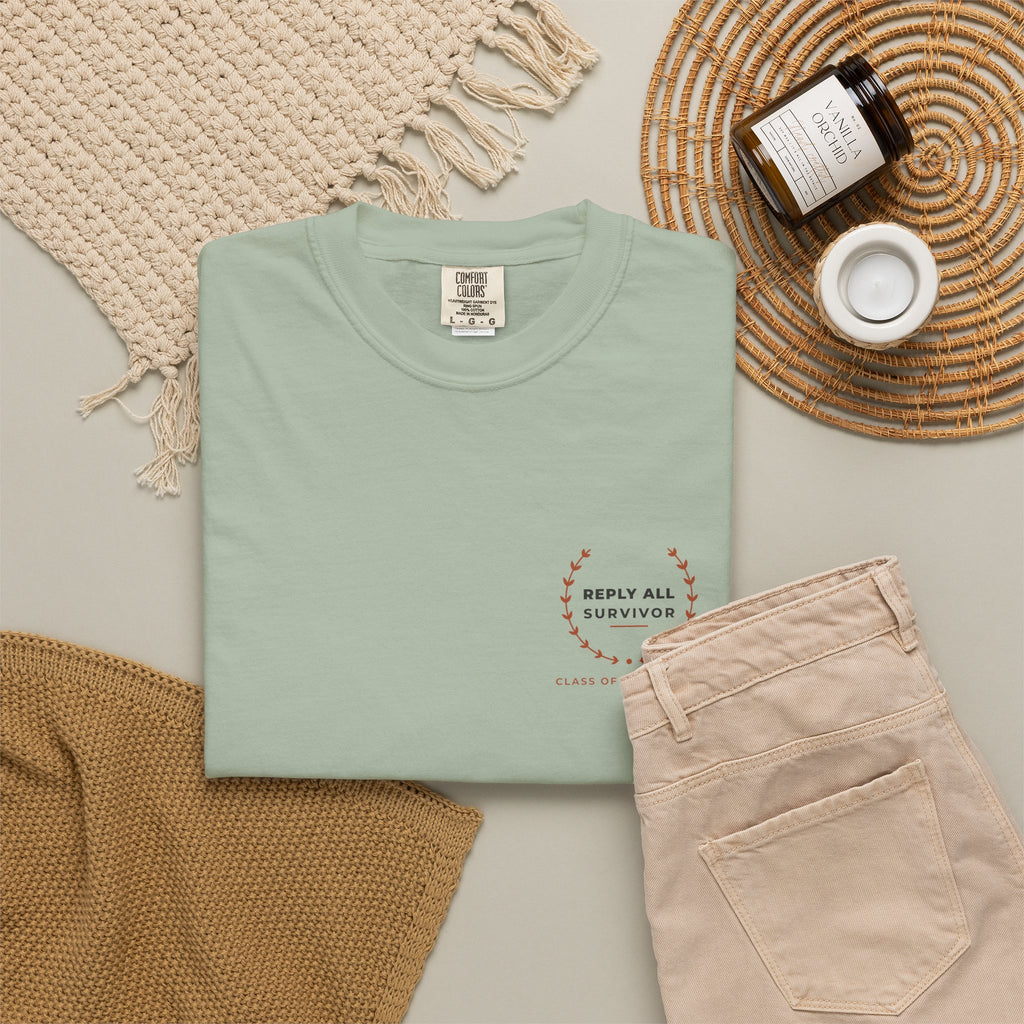 Flat-lay of the bay Reply All Survivor tee by Mildly Unavailable
