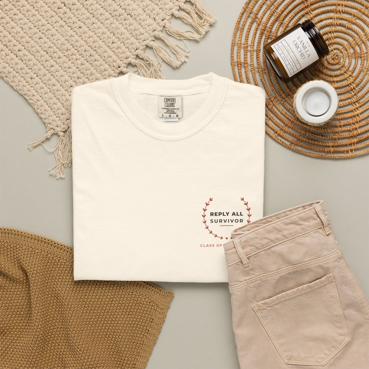 Flat-lay of the ivory Reply All Survivor tee by Mildly Unavailable