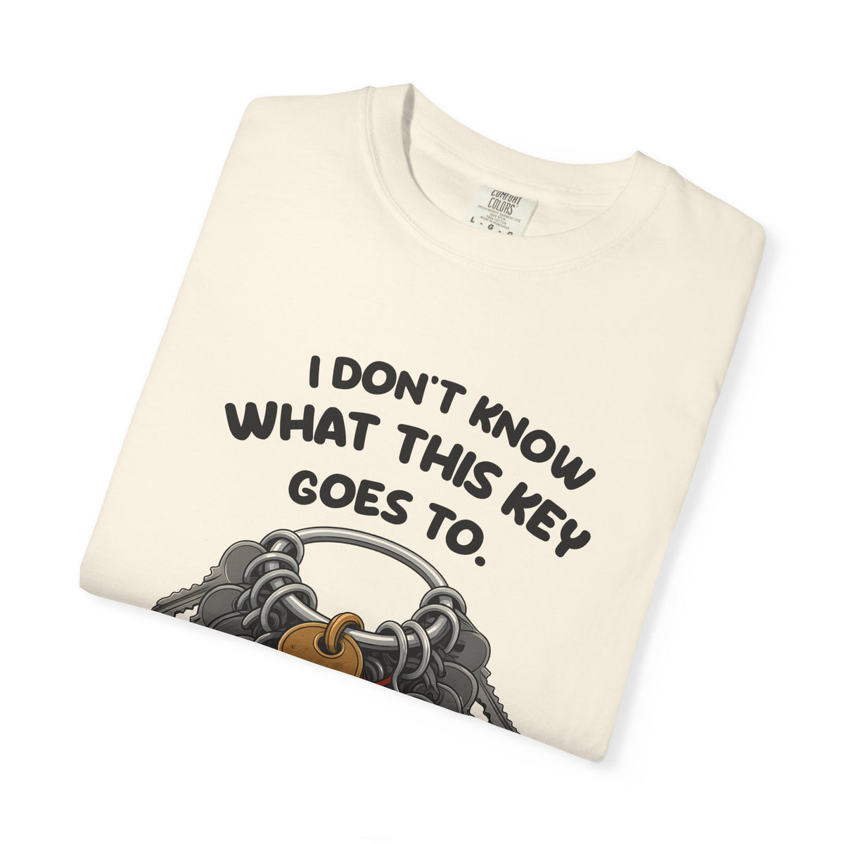 Folded ivory I Don't Know What This Key Goes To tee by Mildly Unavailable, close-up of the front design