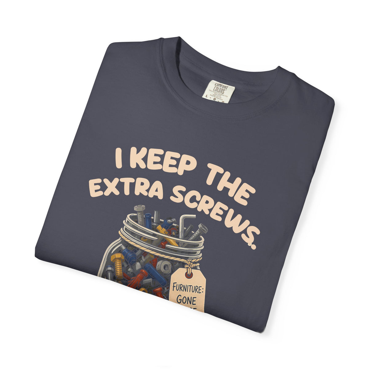 Folded navy I Keep the Extra Screws tee by Mildly Unavailable, close-up of the front design