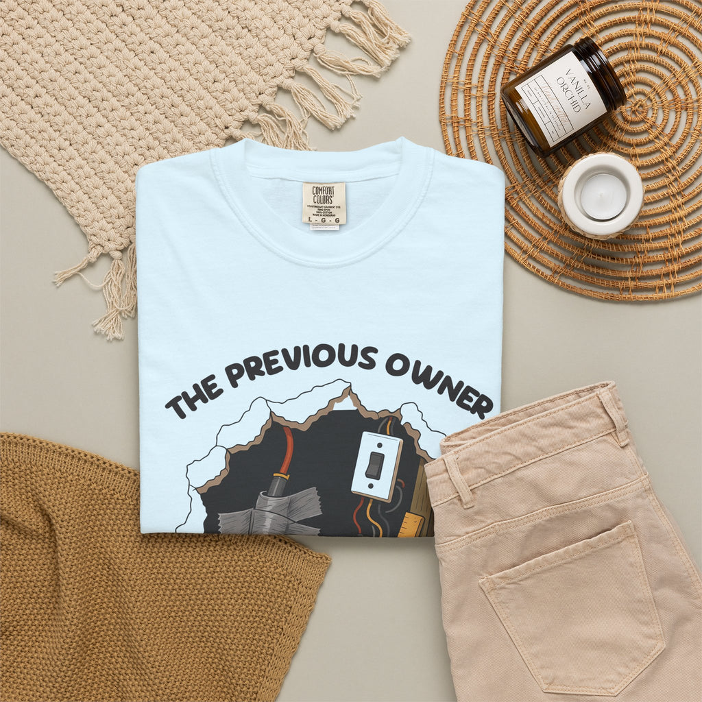 Chambray The Previous Owner Did It Himself tee by Mildly Unavailable laid flat with folded pants and home decor