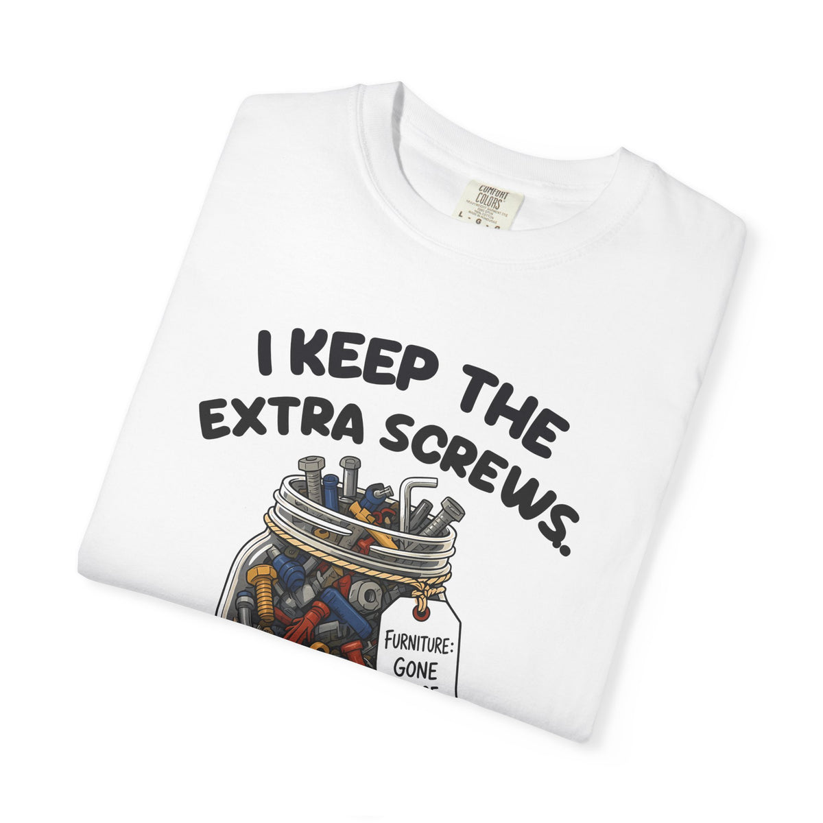 Folded white I Keep the Extra Screws tee by Mildly Unavailable, close-up of the front design
