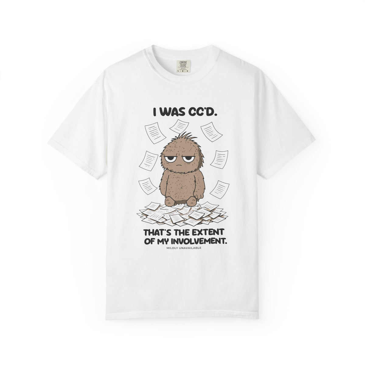 White tee with the I Was CC'd design: Murray, a grumpy furry little guy, sitting in a pile of paper with the line That's the extent of my involvement, by Mildly Unavailable