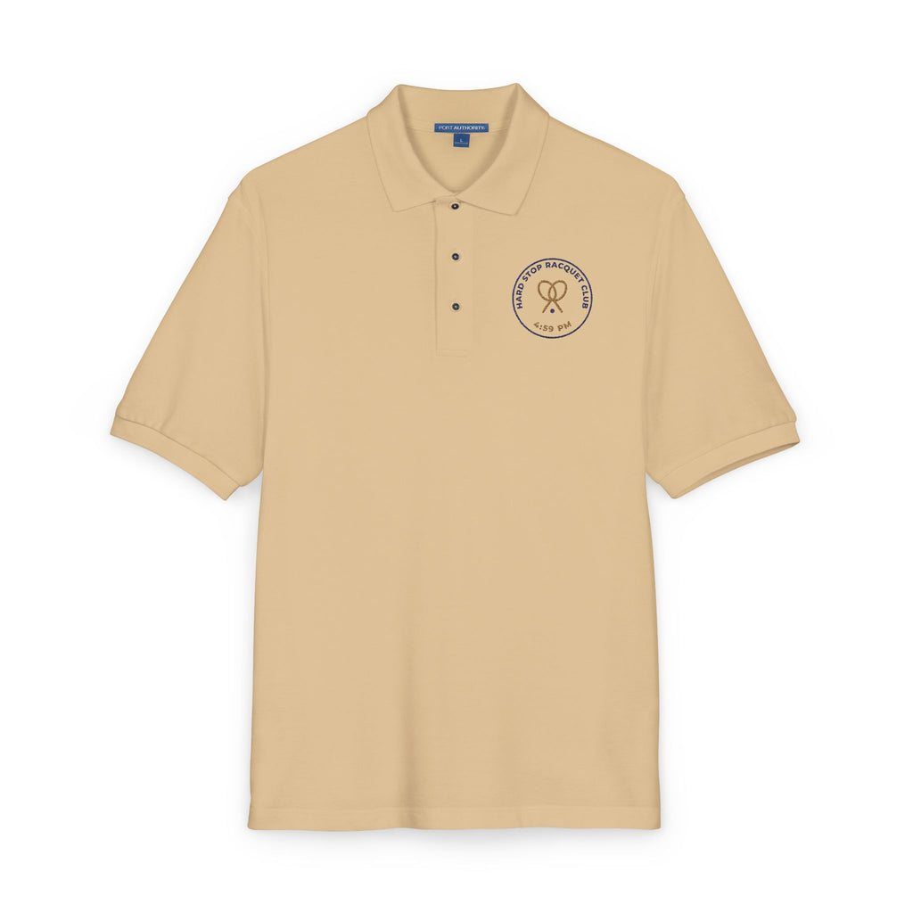 Close-up of the embroidered chest on the stone Hard Stop Racquet Club polo by Mildly Unavailable