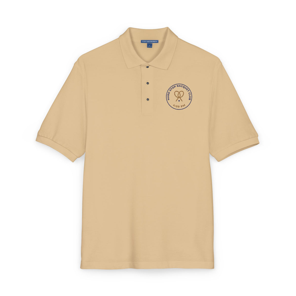 Close-up of the embroidered chest on the stone Hard Stop Racquet Club polo by Mildly Unavailable