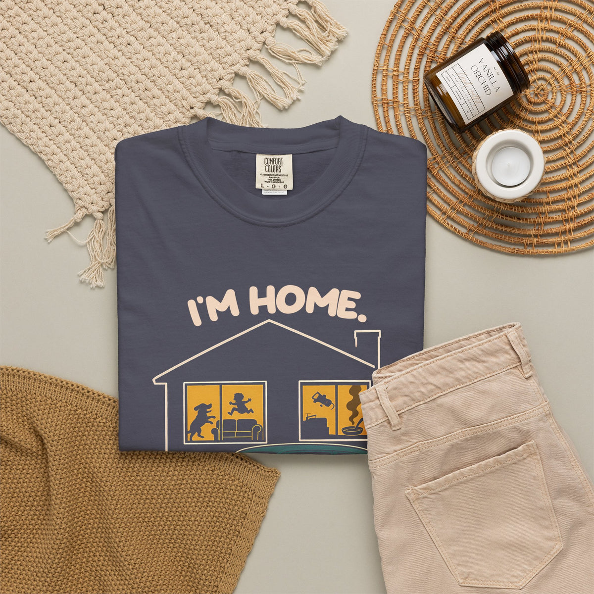 Navy Just Sitting in the Car for a Minute Murray tee by Mildly Unavailable laid flat with folded pants and home decor