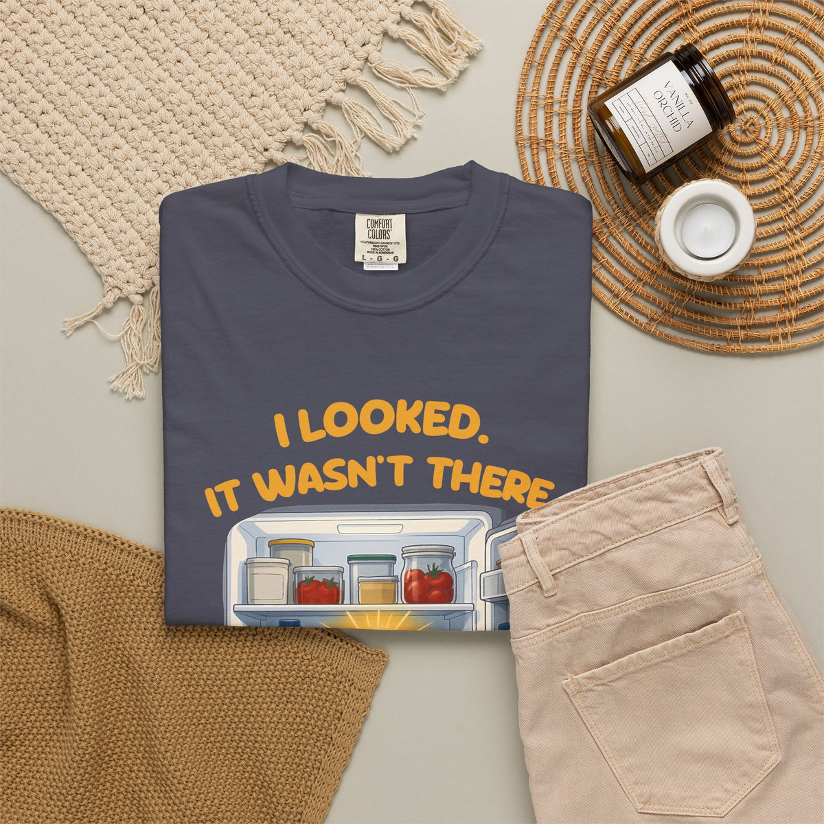 Navy I Looked. It Wasn't There. It Was There. tee by Mildly Unavailable laid flat with folded pants and home decor