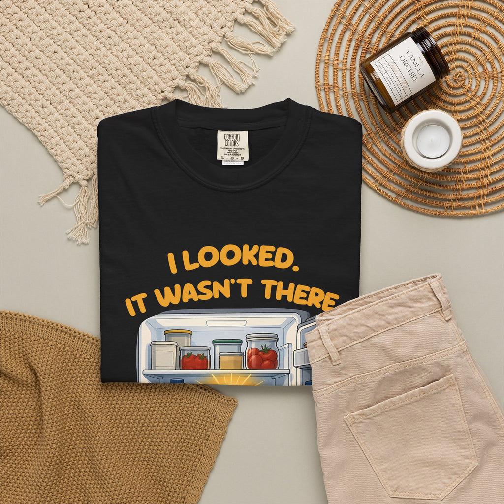 Black I Looked. It Wasn't There. It Was There. tee by Mildly Unavailable laid flat with folded pants and home decor