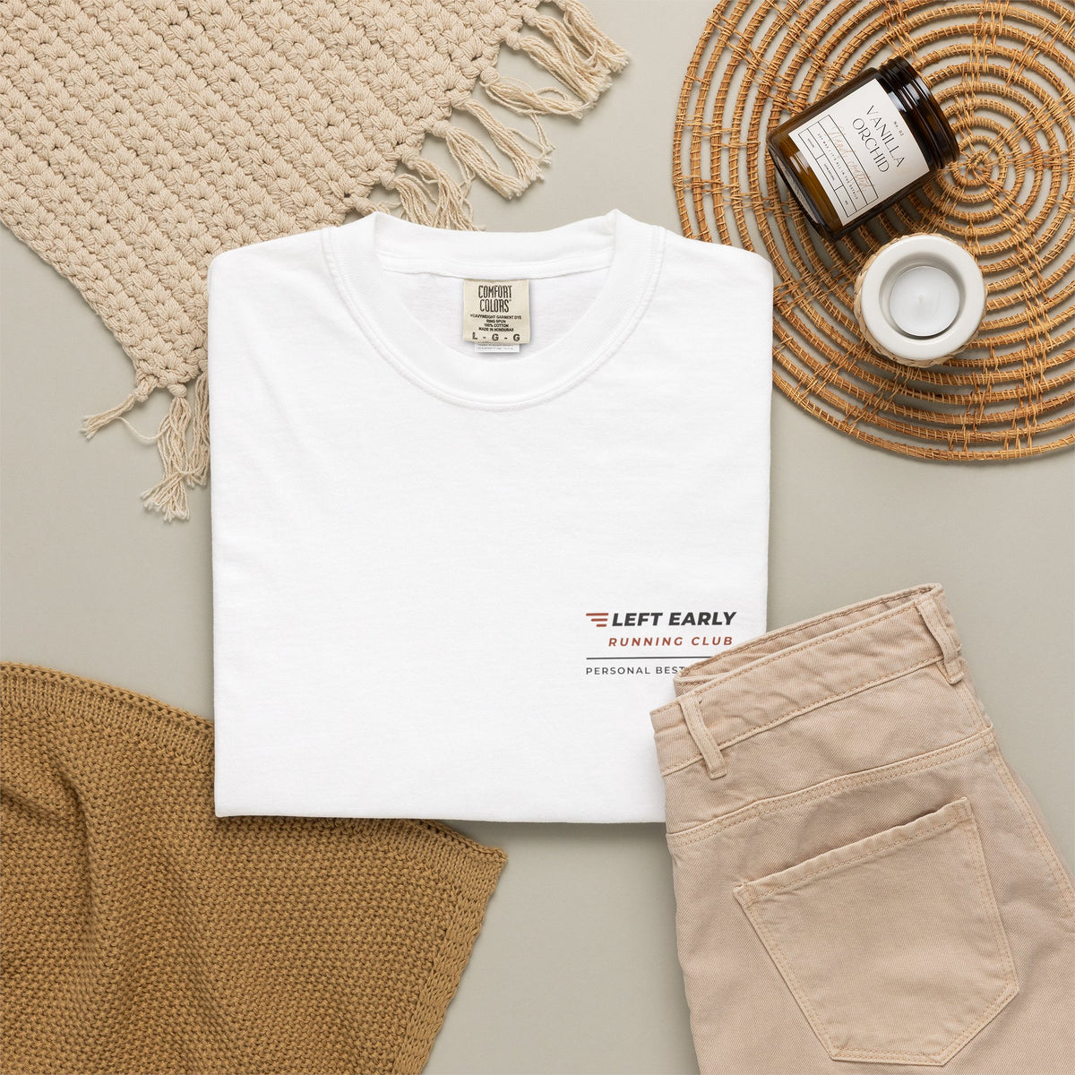 Flat-lay of the white Left Early Running Club tee by Mildly Unavailable