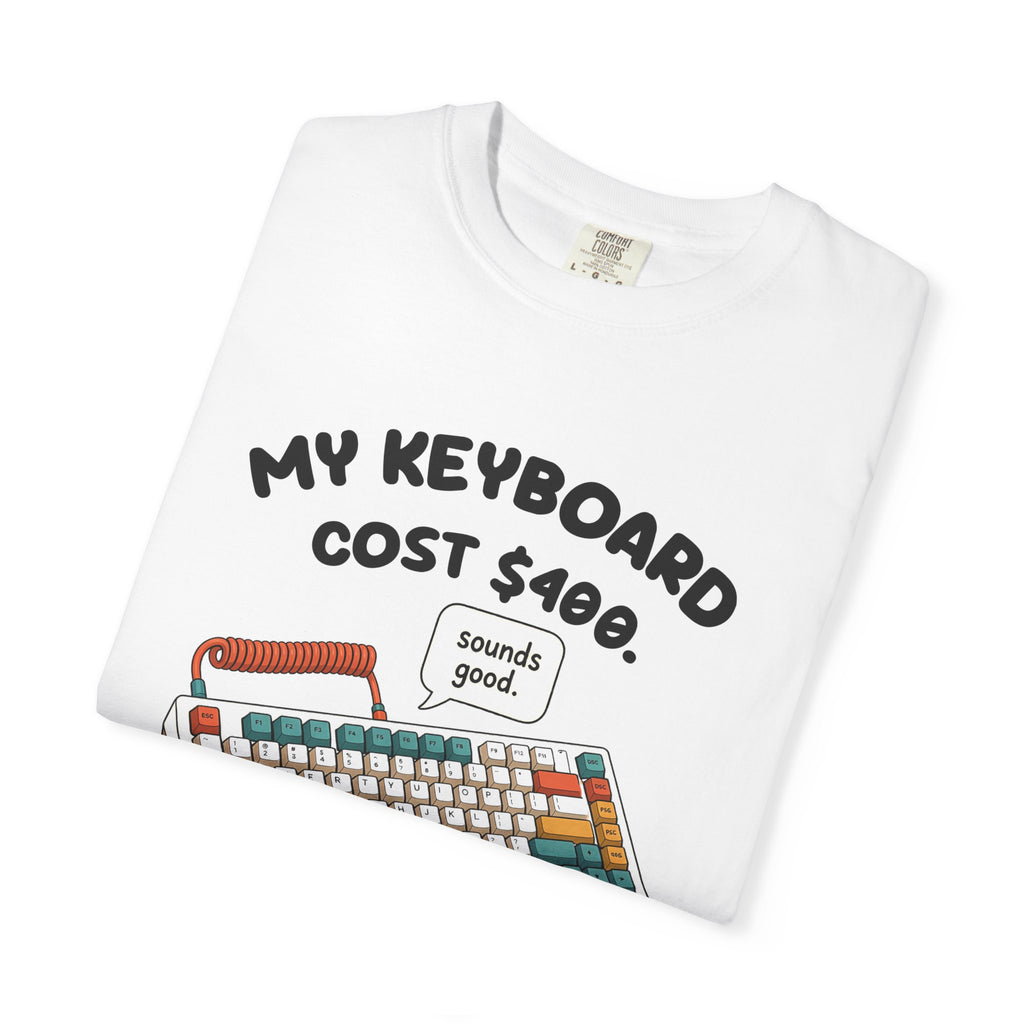 Folded white My Keyboard Cost $400 tee by Mildly Unavailable, close-up of the front design
