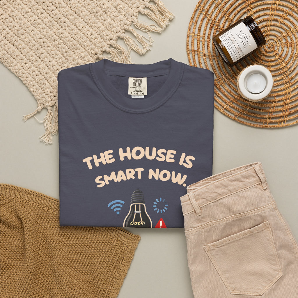Navy The House Is Smart Now tee by Mildly Unavailable laid flat with folded pants and home decor