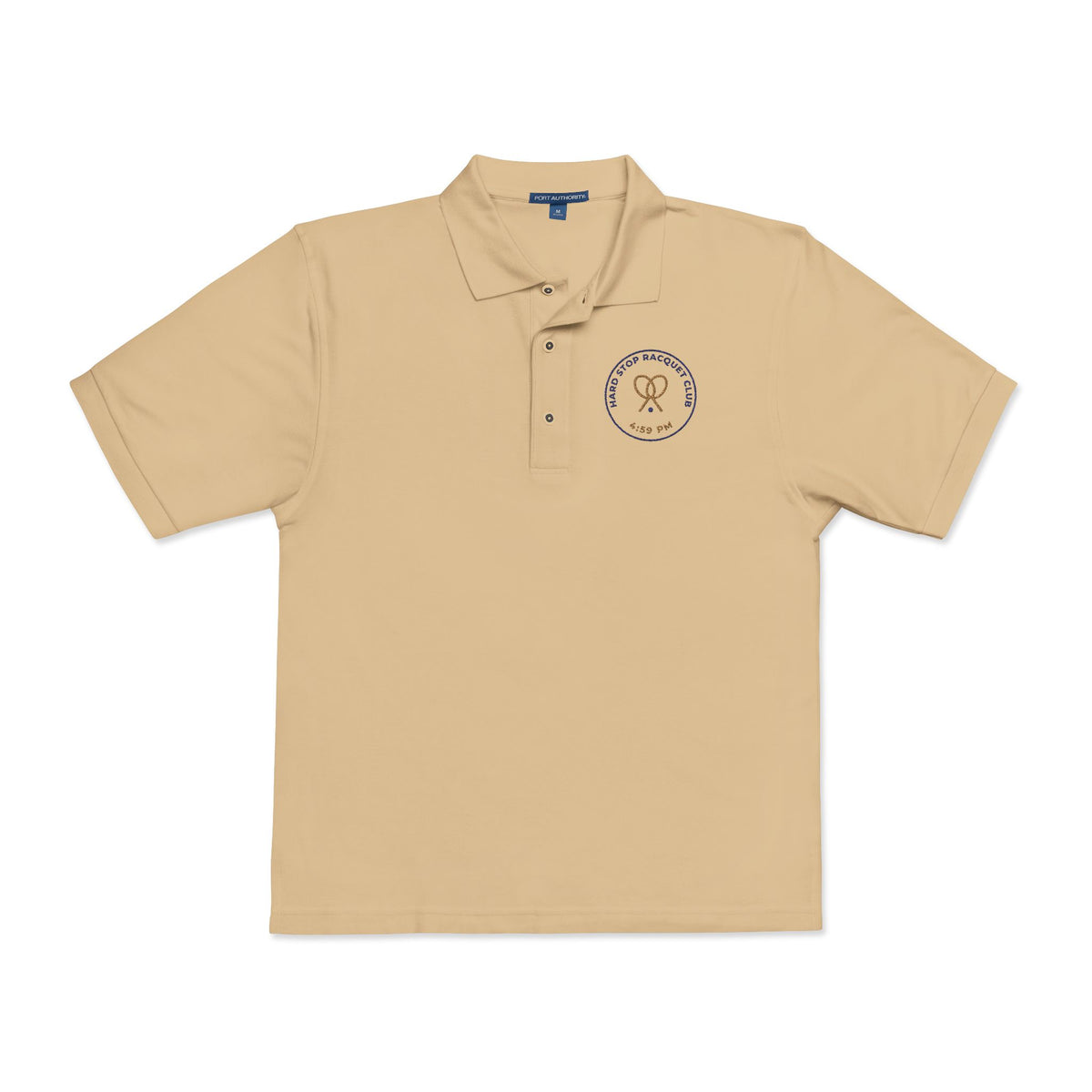 Front of the stone Hard Stop Racquet Club polo by Mildly Unavailable: an embroidered Hard Stop Racquet Club polo, 4:59 PM