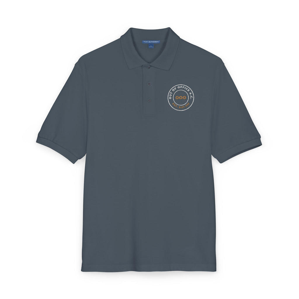 Close-up of the embroidered chest on the steel grey Out of Office Athletic Club polo by Mildly Unavailable