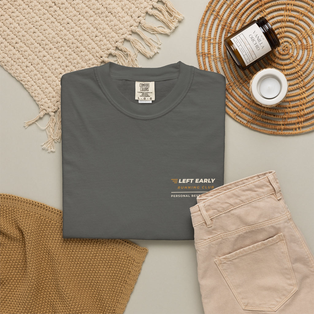 Flat-lay of the pepper Left Early Running Club tee by Mildly Unavailable