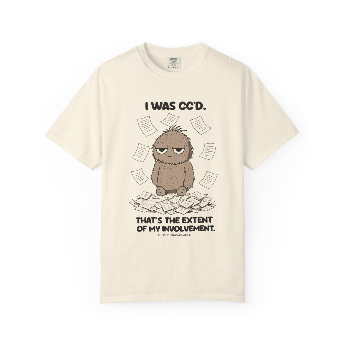 Ivory tee with the I Was CC'd design: Murray, a grumpy furry little guy, sitting in a pile of paper with the line That's the extent of my involvement, by Mildly Unavailable