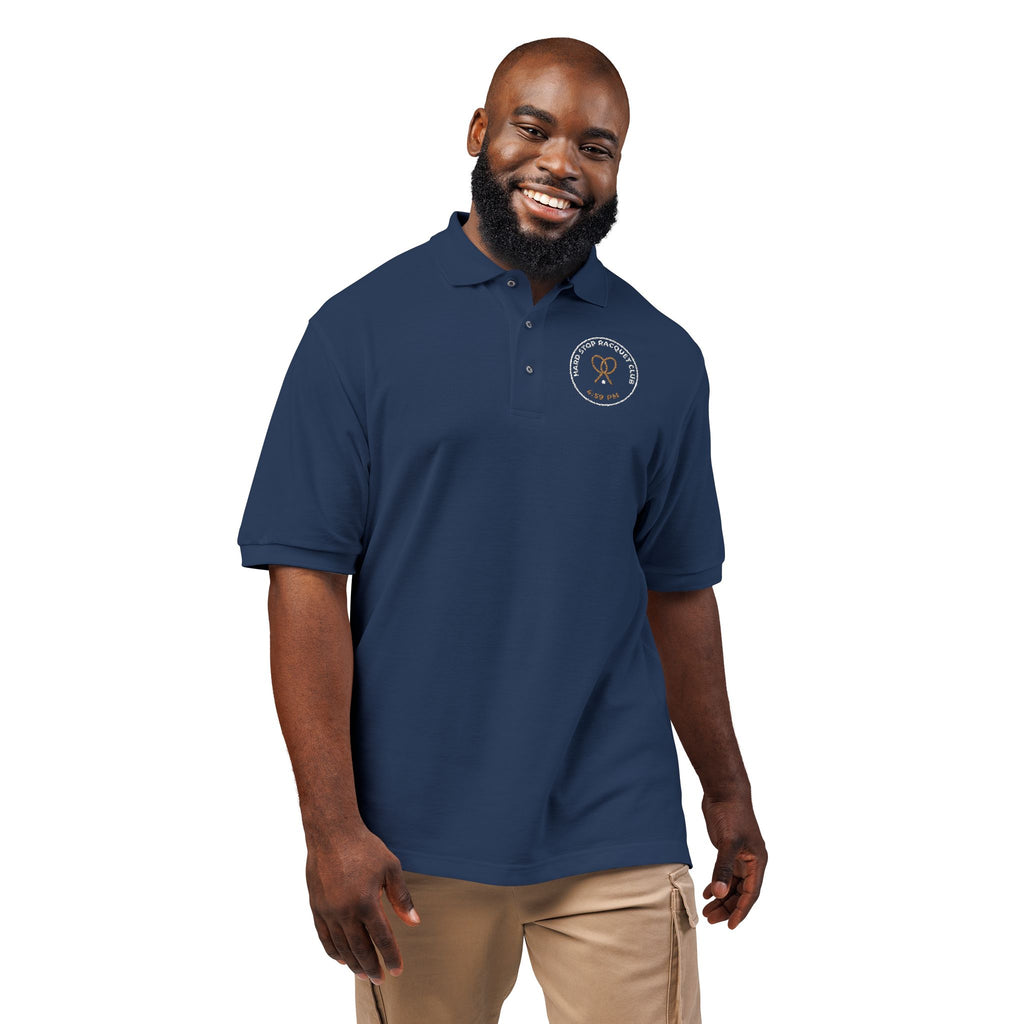 Model wearing the navy Hard Stop Racquet Club polo by Mildly Unavailable
