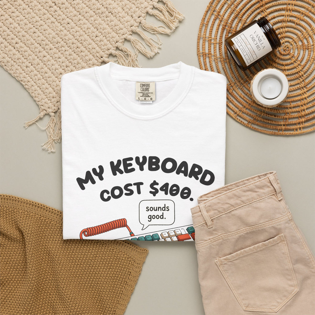 White My Keyboard Cost $400 tee by Mildly Unavailable laid flat with folded pants and home decor