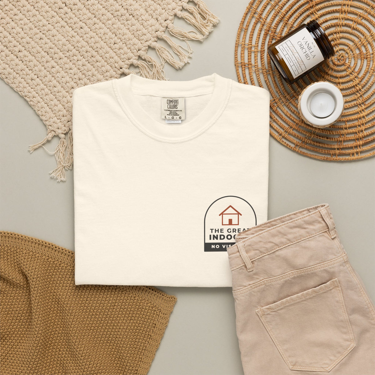 Flat-lay of the ivory The Great Indoors tee by Mildly Unavailable