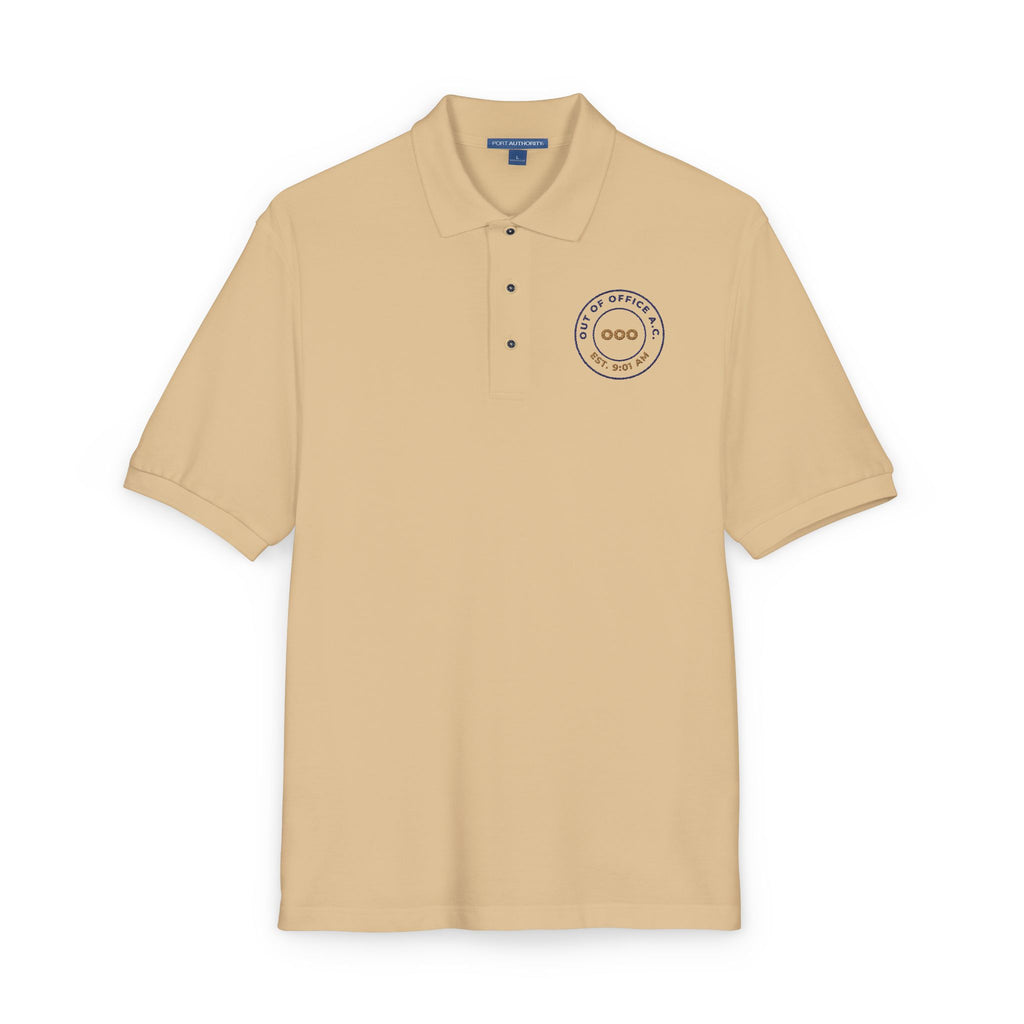 Close-up of the embroidered chest on the stone Out of Office Athletic Club polo by Mildly Unavailable