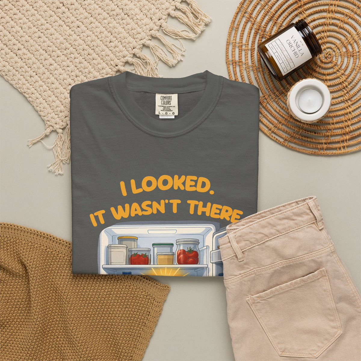 Pepper I Looked. It Wasn't There. It Was There. tee by Mildly Unavailable laid flat with folded pants and home decor