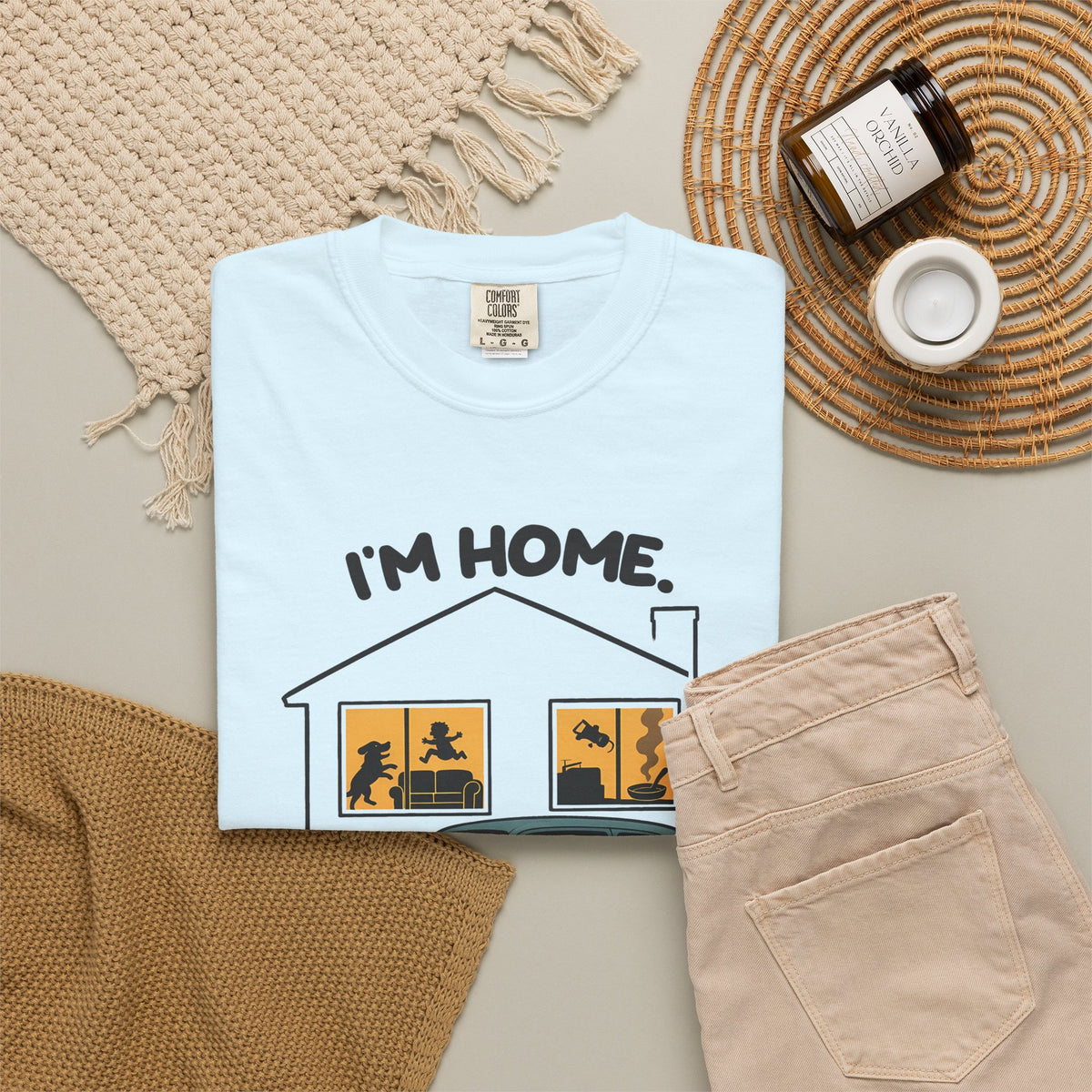 Chambray Just Sitting in the Car for a Minute Murray tee by Mildly Unavailable laid flat with folded pants and home decor