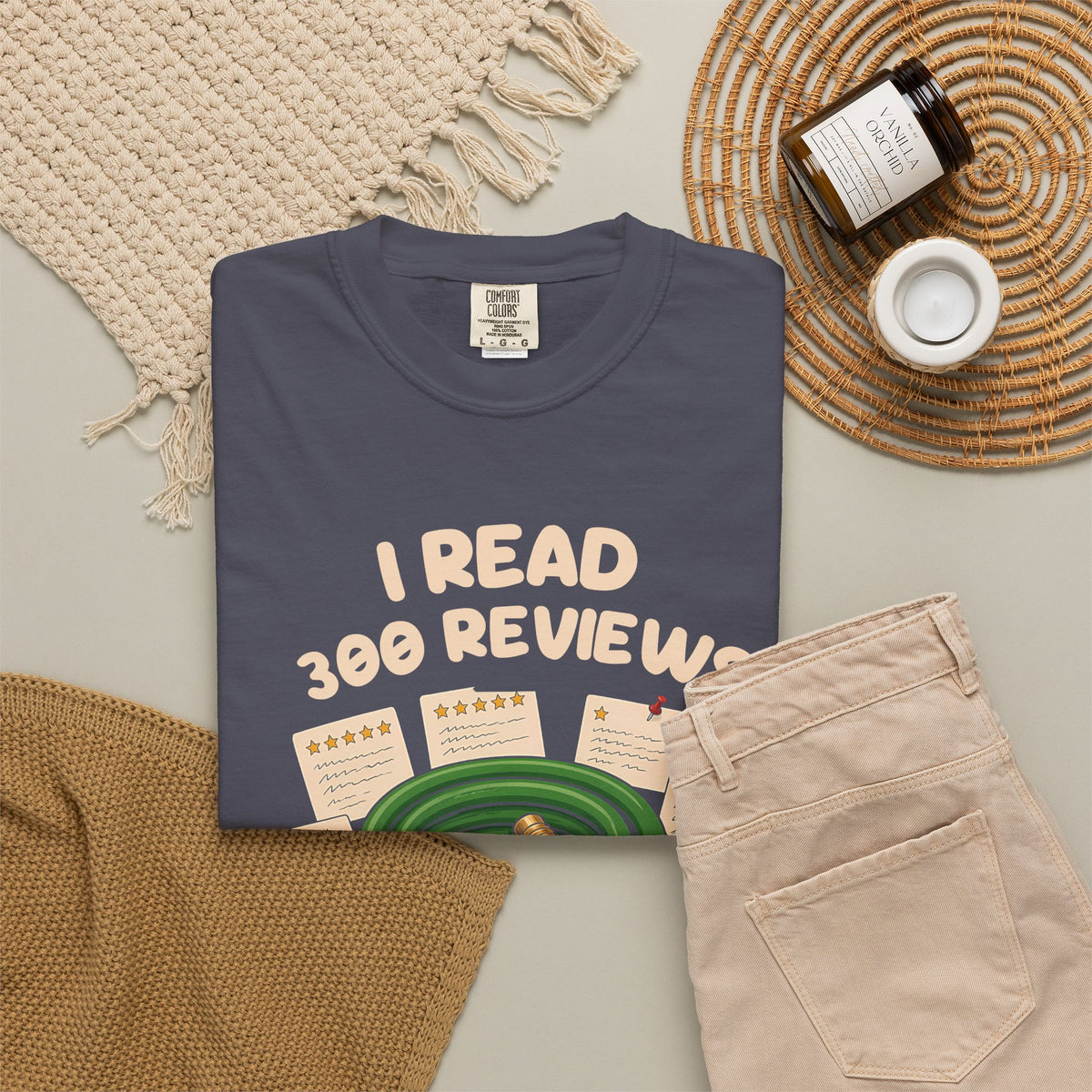 Navy I Read 300 Reviews for a Garden Hose tee by Mildly Unavailable laid flat with folded pants and home decor