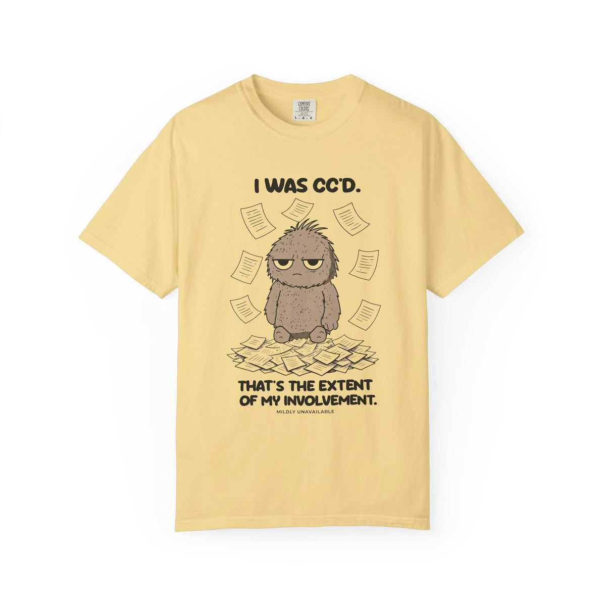 Butter tee with the I Was CC'd design: Murray, a grumpy furry little guy, sitting in a pile of paper with the line That's the extent of my involvement, by Mildly Unavailable