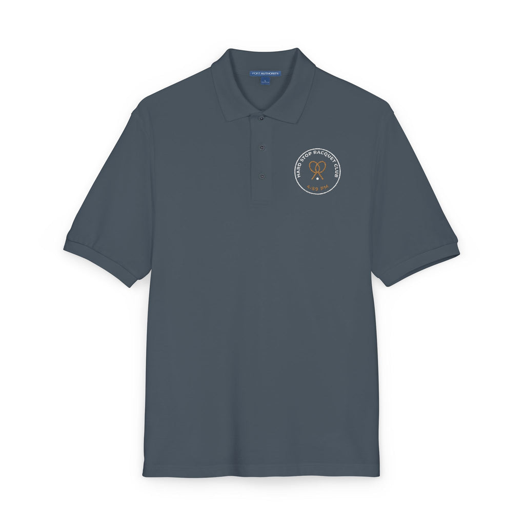 Close-up of the embroidered chest on the steel grey Hard Stop Racquet Club polo by Mildly Unavailable