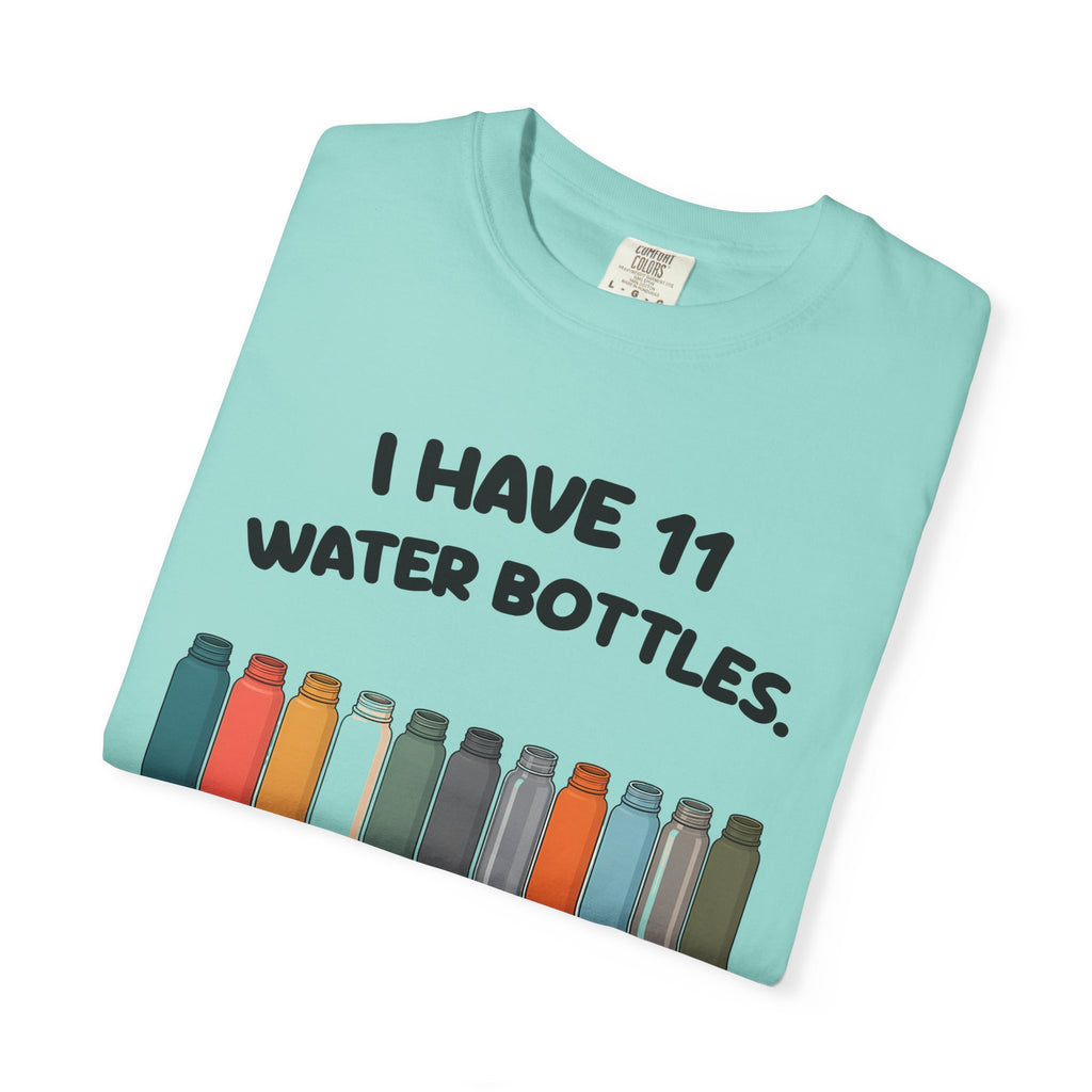 Folded chalky mint 11 Water Bottles, No Lids tee by Mildly Unavailable, close-up of the front design