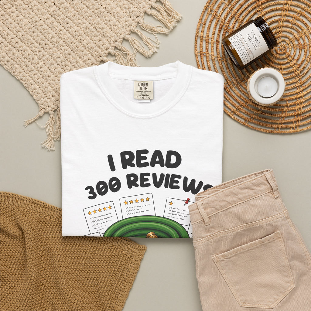 White I Read 300 Reviews for a Garden Hose tee by Mildly Unavailable laid flat with folded pants and home decor