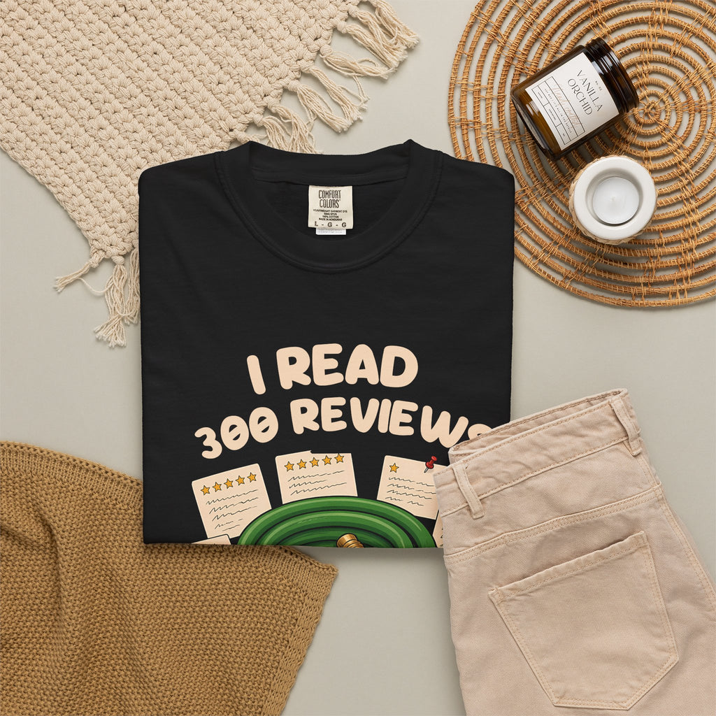 Black I Read 300 Reviews for a Garden Hose tee by Mildly Unavailable laid flat with folded pants and home decor