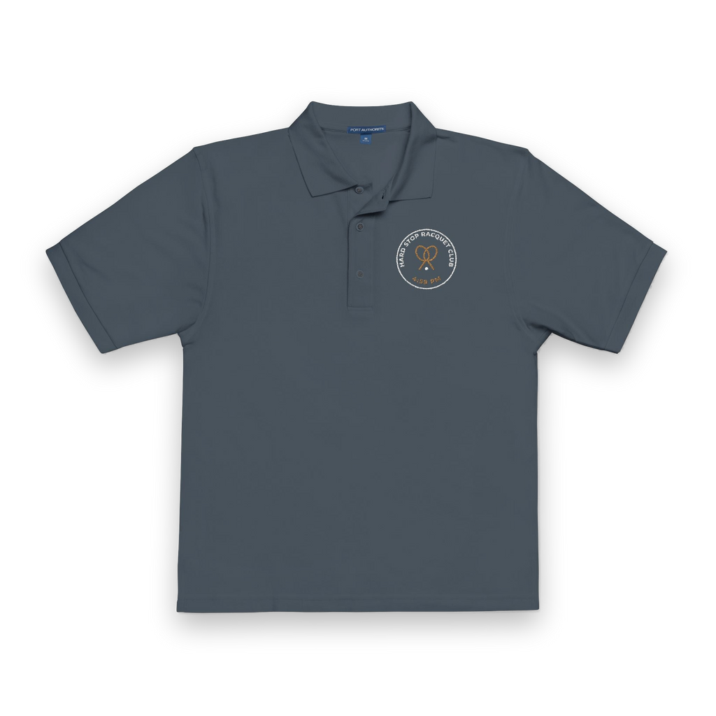 Front of the steel grey Hard Stop Racquet Club polo by Mildly Unavailable: an embroidered Hard Stop Racquet Club polo, 4:59 PM